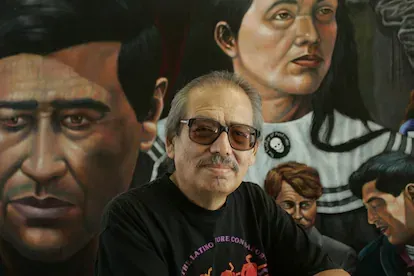 Emigdio Vasquez, 65, of Orange, shown in front of his mural "The Legacy of Cesar Chavez" at the Cesar Chavez Building at Santa Ana College, is a muralist and painter focusing on Chicano issues, photog