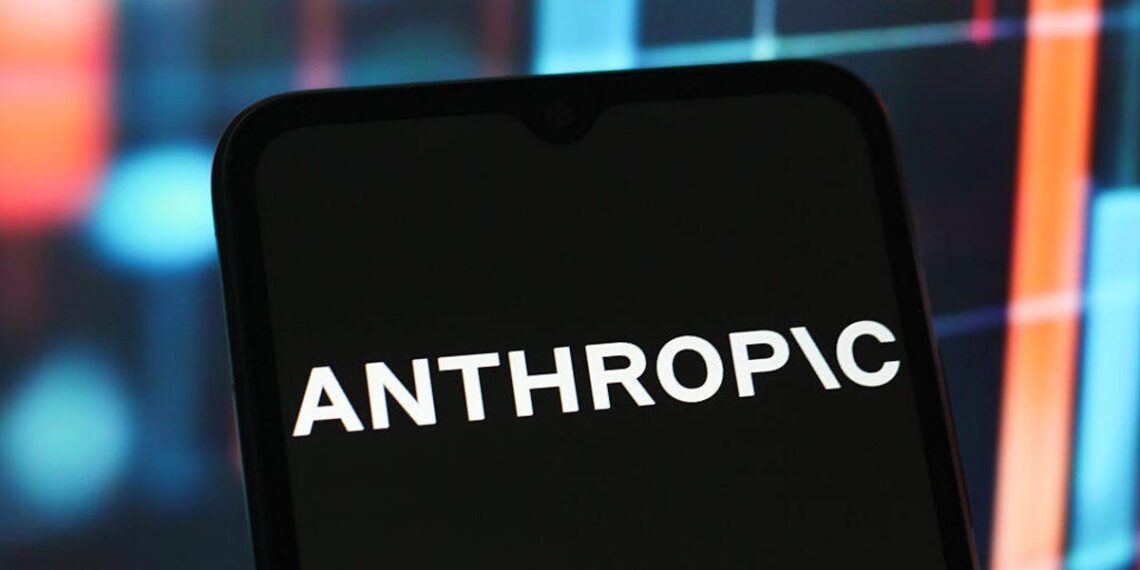 Anthropic logo on a black phone in front of a rainbow background