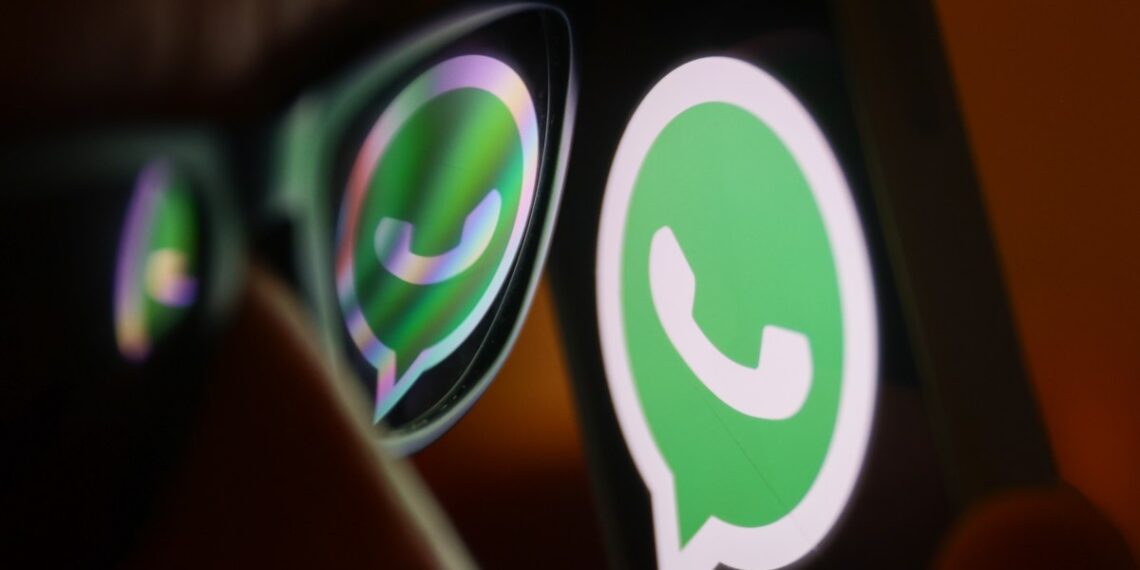 WhatsApp logo reflected on sunglasses and displayed on a phone screen.