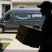 Amazon truck pulling away from San Diego fulfillment center on the way to make a package delivery.