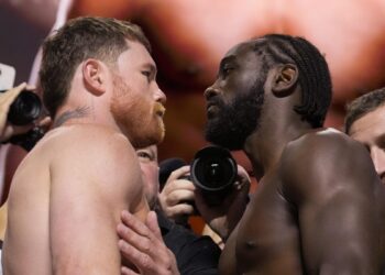canelo alvarez and terrence crawford face each other at weigh-in