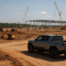 Governor Brian Kemp and Rivian CEO RJ Scaringe break ground at the planned Georgia factory.