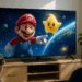 Title card for The Super Mario Galaxy Movie with a Star character whooping