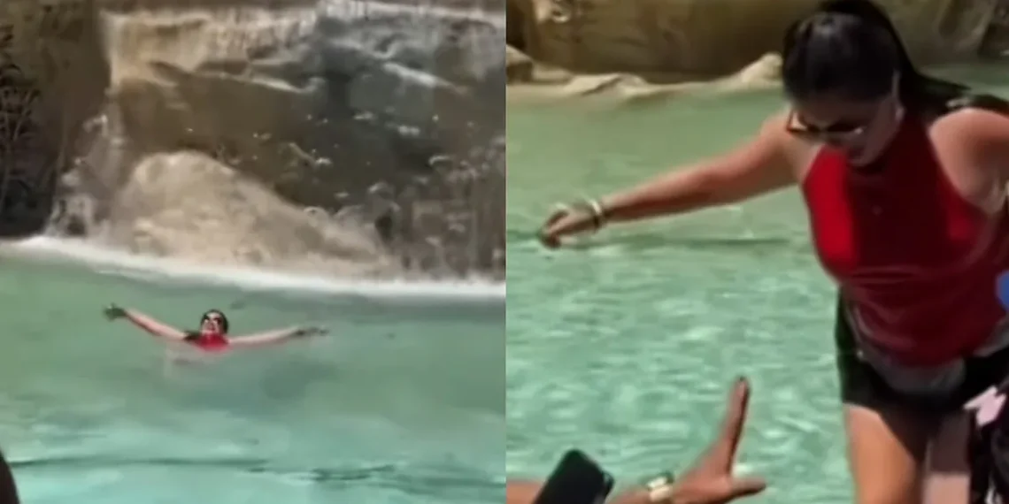 Una turista se lanza a la Fontana di Trevi en Roma para refrescarse por la ola de calor