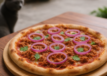 La célebre cochinita del estadio de los Diablos Rojos ahora llega en forma de pizza