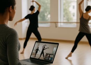 Photo of a dance instructor leading a group of young children practicing a cross-armed movement in a studio with brick walls and wood floors.